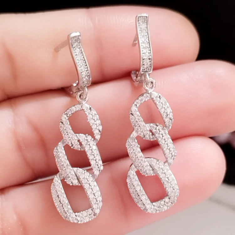 سرویس نقره زنانه عیار 925 طرح جواهر با روکش طلا سفید مدل دستبند و گوشواره و گردنبند